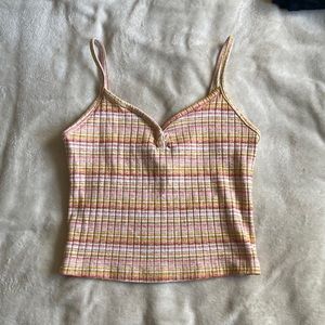 Striped peachy pink and gold tank top.